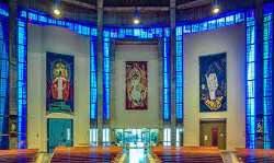 The artwork in the cathedral has a different story. The whole artwork was designed by Trace Emin who named the artwork 'The Roman Standard'. The artwo